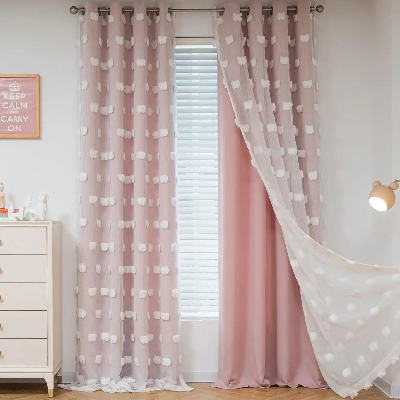 An elegant addition to any kids' bedroom or playroom, the Pink Pompom Double Layer Curtain is designed with unique, eye-catching pom poms that add a touch of sophistication. The double layer of sheer fabric and curtains provides a lightweight and airy atmosphere, perfect for softening the ambiance of any room in your home.