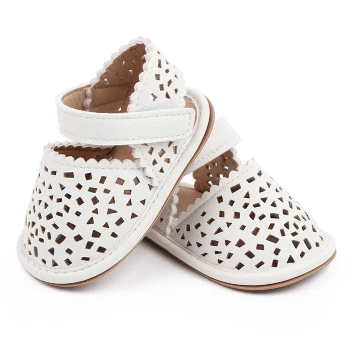 There's nothing cuter than watching your little one take their first steps in our Barcelona Baby Sandals! Available in magenta, white, brown, and black, these non-slip casual shoes feature soft soles for maximum comfort and support. Perfect for little explorers on the go, you can trust that our sandals will keep your baby's precious feet safe and comfy all day long. Give them the gift of style and functionality with our versatile Barcelona Baby Sandals! 