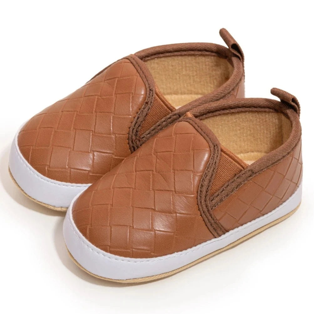 Give your little one the gift of comfort and style with these vintage leather baby shoes! Available in three timeless colors, these slip on shoes are perfect for infants and toddlers up to 18 months old. Say goodbye to uncomfortable and bland footwear for your child and hello to these adorable and functional shoes. Get them now and see your baby take their first steps in style