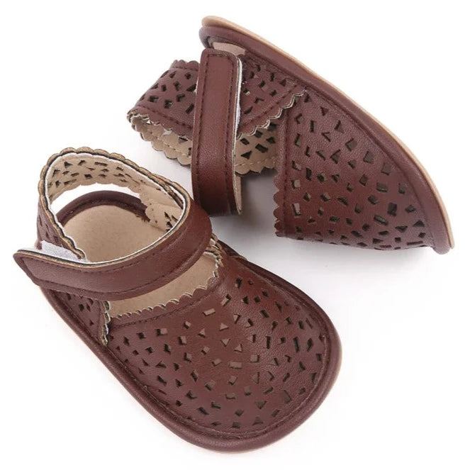 There's nothing cuter than watching your little one take their first steps in our Barcelona Baby Sandals! Available in magenta, white, brown, and black, these non-slip casual shoes feature soft soles for maximum comfort and support. Perfect for little explorers on the go, you can trust that our sandals will keep your baby's precious feet safe and comfy all day long. Give them the gift of style and functionality with our versatile Barcelona Baby Sandals! 