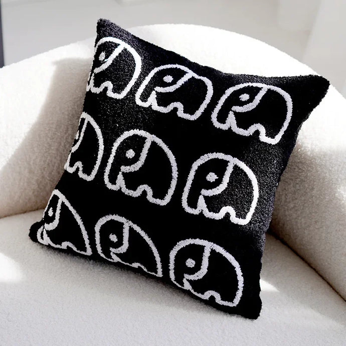 Transform your child's bedroom with our adorable Geometric Elephant Pillow Cover, available in both black and white. Turn your child's room into a playful and stylish oasis with our charming Geometric Elephant Pillow Cover - now in black and white for versatility!
