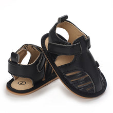 Load image into Gallery viewer, Give your baby&#39;s feet the royal treatment with black baby sandals! Soft and flexible, these beautiful sandals come in an array of colors to suit any style. Offering baby-perfect fit and comfort, they provide extra stability and support their growing feet. Treat your baby to a touch of luxury with Milan Baby Sandals!  Upper Material: Cotton  Outsole Material: Rubber Heel Type: Flat 
