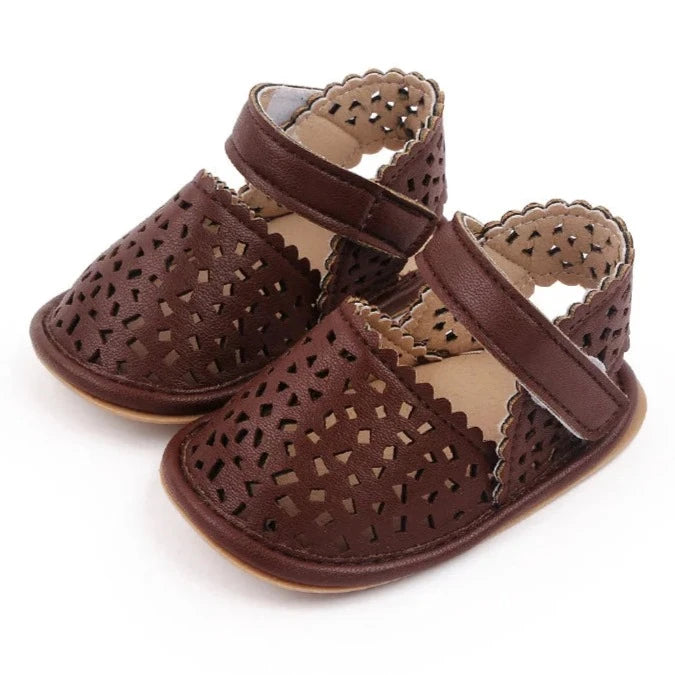 There's nothing cuter than watching your little one take their first steps in our Barcelona Baby Sandals! Available in magenta, white, brown, and black, these non-slip casual shoes feature soft soles for maximum comfort and support. Perfect for little explorers on the go, you can trust that our sandals will keep your baby's precious feet safe and comfy all day long. Give them the gift of style and functionality with our versatile Barcelona Baby Sandals! 