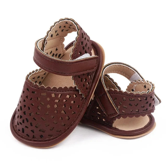 There's nothing cuter than watching your little one take their first steps in our Barcelona Baby Sandals! Available in magenta, white, brown, and black, these non-slip casual shoes feature soft soles for maximum comfort and support. Perfect for little explorers on the go, you can trust that our sandals will keep your baby's precious feet safe and comfy all day long. Give them the gift of style and functionality with our versatile Barcelona Baby Sandals! 