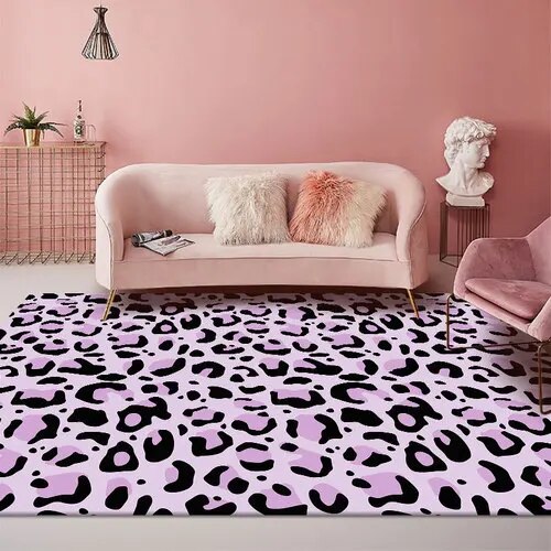 Dress your kid's bedroom floor with this cool purple leopard rug! With its bold black and white pattern, you'll be able to jazz up your space with ease. Plus, it's made of polyester and is easy to clean, so you can keep it looking stylish for years to come. Get it now and bring some rug fashion into your teen's bedroom!