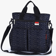 Load image into Gallery viewer, This Multifunctional Navy Diaper Bag boasts a waterproof design and is perfect for busy moms who need to quickly change their baby&#39;s clothes or diapers. It is also suitable for nursing and has multiple compartments for efficient organization.
