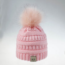 Load image into Gallery viewer, Keep your kid warm with this pink beanie hat. Great for children age 1 to 7 years. This knitted cotton hat comes in red, yellow, beige, pink, black, white and grey.
