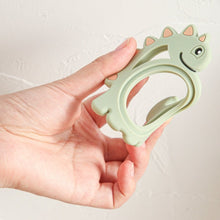 Load image into Gallery viewer, Dinosaur silicone teether for your little baby or toddler. this teether is great for kids ages 6 months to 3 years. And don&#39;t forget it is a cute gift too!
