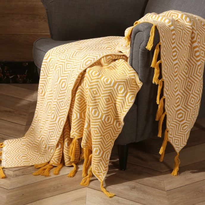 Your little one can drift off into dreamland with sweet softness and warmth. Wrap them up in this sumptuously soft yellow knitted blanket, crafted from lightweight material for ultimate comfort. Experience the luxurious coziness of a better night's sleep!  Size: 50 x 62 inches (130cm x 160cm) Material: 100% High Quality Acrylic Machine Wash: Color separate in a gentle cold water cycle. Tumble dry low, Low iron.