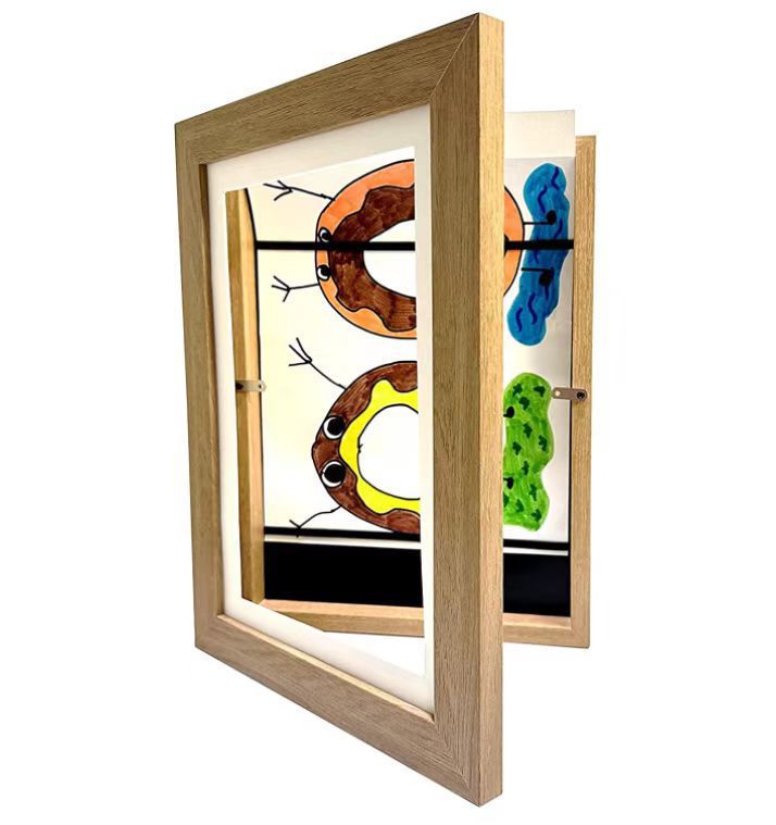 Changeable kids art frame in natural wood for their drawings and paintings. This art frame provides the perfect display for A4 or smaller artworks and holds about 50 -150 pieces of art depending on paper thickness. These frames are made of a high-quality glossy acrylic and environmentally MDF material. You can hang them horizontal or vertical. Size: 12.59 x 9.44 x 1.14 inches thick (32cm x 24cm x 2.9cm)