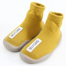 Load image into Gallery viewer, Super cool and sturdy indoor yellow non-skid baby and toddler shoes for your first time walker. These super cool shoes come in yellow, black, red, grey and brown. This kids footwear is for ages 6 months to 4 year. Free shipping.
