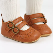 Load image into Gallery viewer, These brown leather shoes are perfect for your first time crawler and walker. These soft sole shoes are for baby girls ages 0 to 18 months old girl. Free shipping.
