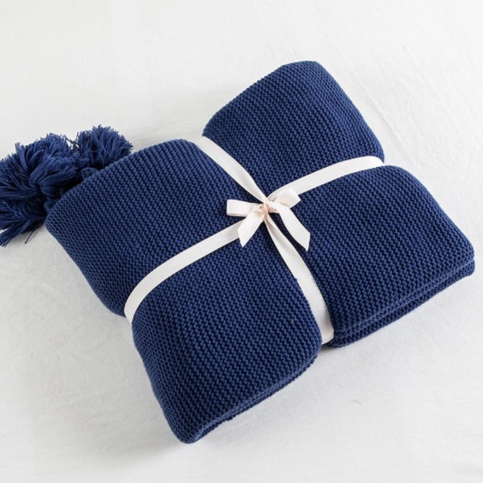 Cozy up your little one with this super comfortable navy blue throw blanket. Knitted from the softest materials, its luxurious texture will have your kids dreaming peacefully. Make bedtime extra special with this delightful blanket. Cuddle up and enjoy sweet dreams!  Size: 50 x 62 inches (130cm x 160cm) Material: High Quality Acrylic Machine wash colors separately wash in cold water, gentle cycle, tumble dry low, low iron