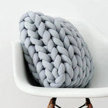 Load image into Gallery viewer, Get cozy with this handmade grey pillow, available in multiple sizes for your little ones&#39; bedroom. Filled with memory foam and made with a blend of polyester and cotton, this knitted pillow is the perfect addition to any playful space.
