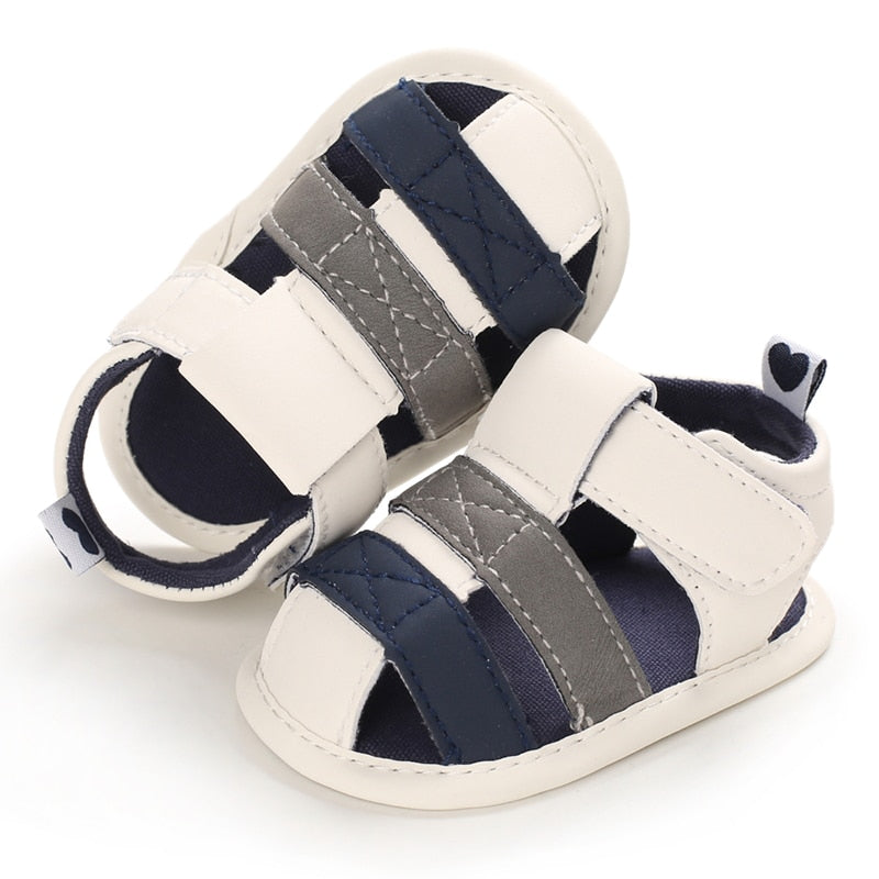 These adorable Summer beige, grey and blue sandals are designed to keep your little one's feet cool in the hot summer months! They come in multiple colors and sizes for newborns up to 18 months, so you'll be sure to find a pair for all your little one's summer adventures. Cute and comfy - it's a win-win! Upper Material: PU Leather. Outsole Material: Cotton. Heel Type: Flat.
