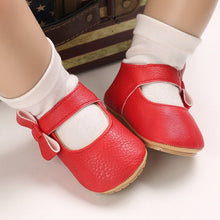 Load image into Gallery viewer, These charming little red bowknot baby shoes are perfect for babies aged newborn to 18 months old. With a choice of colors, they&#39;ll make a delightful addition to any outfit. A soft soled design ensures maximum comfort, while the bow-tie is sure to put a smile on everyone&#39;s face. Upper Material: PU Leather. Outsole Material: Rubber. Closure Type: Hook &amp; Loop.

