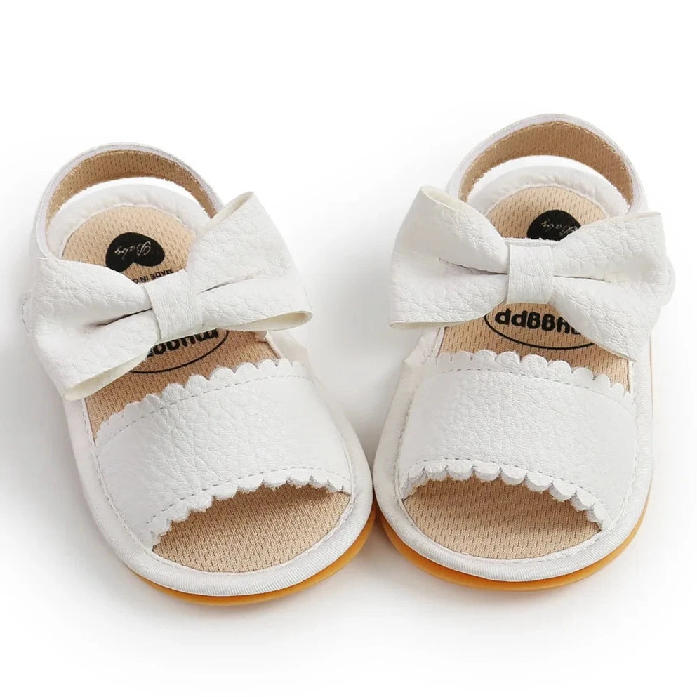 Experience the most adorable and stylish bow sandals for your little one, suitable for newborns to 18 months old. These sandals boast anti-slip protection, a comfortable flat sole, and lightweight design for your baby's safety and comfort.