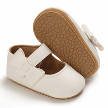 Load image into Gallery viewer, These charming little white bowknot baby shoes are perfect for babies aged newborn to 18 months old. With a choice of colors, they&#39;ll make a delightful addition to any outfit. A soft soled design ensures maximum comfort, while the bow-tie is sure to put a smile on everyone&#39;s face. Upper Material: PU Leather. Outsole Material: Rubber. Closure Type: Hook &amp; Loop.
