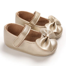 Load image into Gallery viewer, Keep tiny toes cozy and stylish with these adorable Bowknot Baby Shoes. Available in multiple colors, these shoes are perfect for babies between newborn and 18 months. A combination of comfort and practicality for any little princess! Upper Material: PU Leather. Outsole Material: Rubber. Fashion Element: Butterfly-knot. Closure Type: Hook &amp; Loop.

