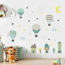 Load image into Gallery viewer, Take your nursery wall to new heights with this whimsical green hot air balloon wall Decal! Featuring a star-filled sky and a moon-lit ride, this fun decal is sure to soar among the stars in your child&#39;s bedroom. So, buckle up and get ready for an adorably adventurous ride! 
