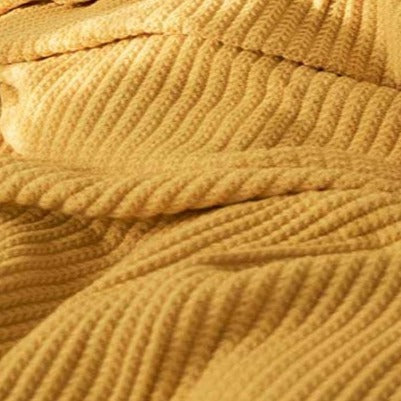 Bring the warmth of comfort with a touch of style to any room with this classic yellow throw blanket. Knitted from lightweight material, it's soft against the skin for luxurious snuggling of your little one. Enjoy cozy nights all year round in luxurious softness.  Size: 50 x 62 inches (127cm x 157cm) Material: 100% High Quality Acrylic Machine Wash: Color separate in a gentle cold water cycle. Tumble dry low, Low iron.