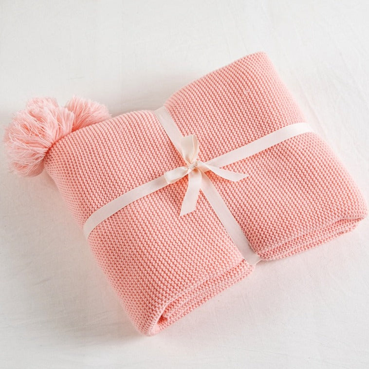 Bring the warmth of cozy comfort into your kid's bedroom with this soft, pink knitted throw blanket! Crafted from light weight material, your little one can snuggle up in luxurious softness for a better night's sleep.  Size: 50 x 62 inches (130cm x 160cm). Material: 100% high quality acrylic.  Machine wash colors separately wash in cold water, gentle cycle, tumble dry low, low iron.