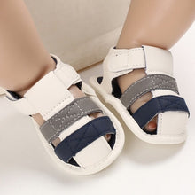 Load image into Gallery viewer, These adorable Summer beige, grey and blue sandals are designed to keep your little one&#39;s feet cool in the hot summer months! They come in multiple colors and sizes for newborns up to 18 months, so you&#39;ll be sure to find a pair for all your little one&#39;s summer adventures. Cute and comfy - it&#39;s a win-win! Upper Material: PU Leather. Outsole Material: Cotton. Heel Type: Flat.
