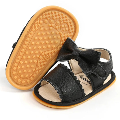 Experience the most adorable and stylish bow sandals for your little one, suitable for newborns to 18 months old. These sandals boast anti-slip protection, a comfortable flat sole, and lightweight design for your baby's safety and comfort.