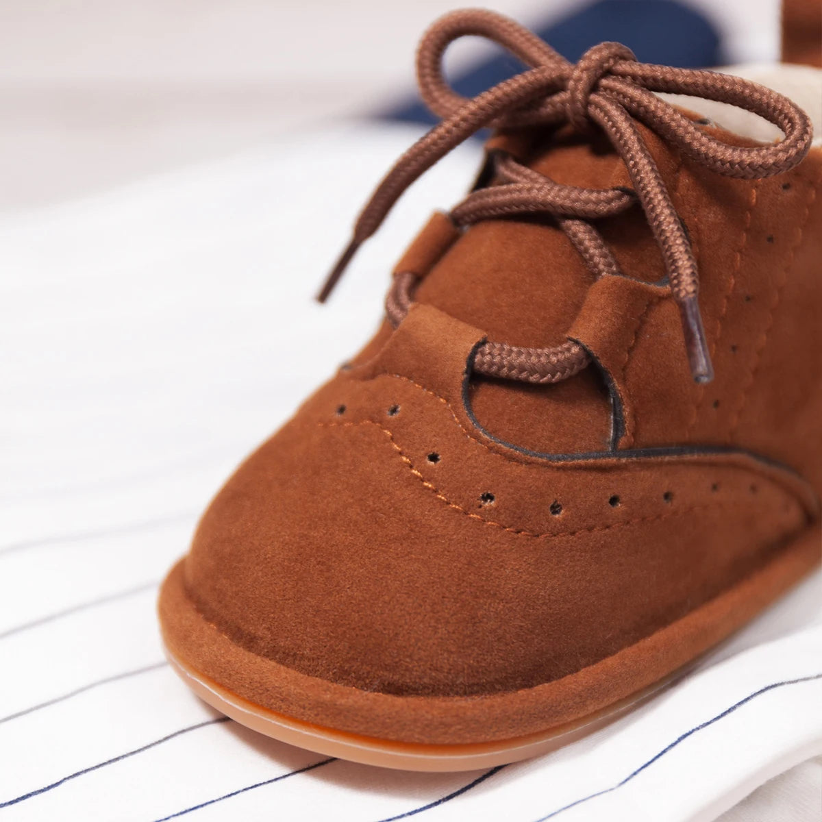 Get ready to "aww" over these adorable baby boots, available in brown or black for your little angel. They boast anti-slip technology, a flat design, breathable material, and are lightweight for your little one's comfort.