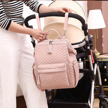 Load image into Gallery viewer, The ultimate pink diaper backpack for your little one - waterproof and stylish! The convenience and durability of our diaper backpack make it the perfect choice for busy parents who want to keep their little ones dry and looking cute on any adventure!
