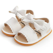 Load image into Gallery viewer, Experience the most adorable and stylish bow sandals for your little one, suitable for newborns to 18 months old. These sandals boast anti-slip protection, a comfortable flat sole, and lightweight design for your baby&#39;s safety and comfort.
