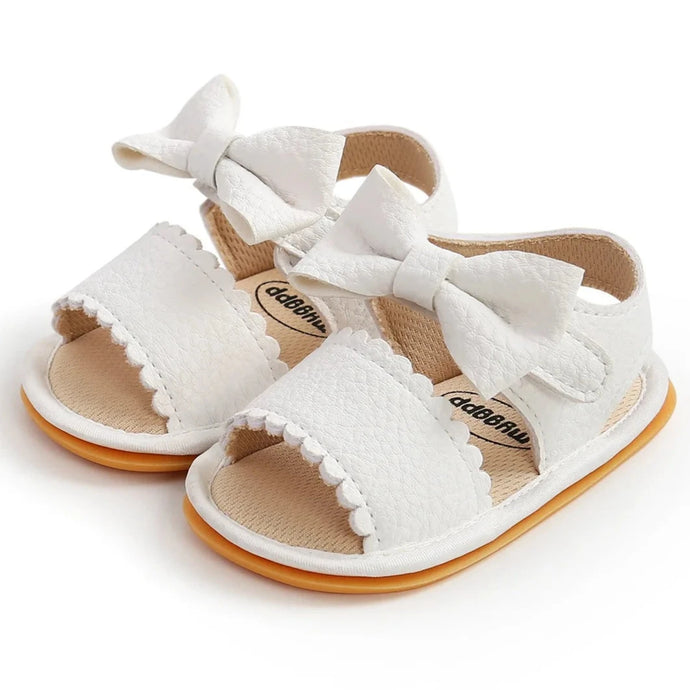 Experience the most adorable and stylish bow sandals for your little one, suitable for newborns to 18 months old. These sandals boast anti-slip protection, a comfortable flat sole, and lightweight design for your baby's safety and comfort.