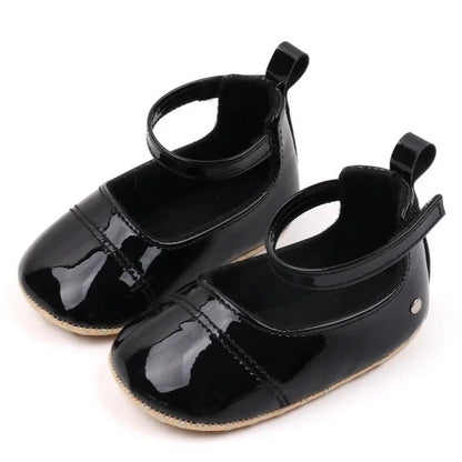 The perfect first time walker shoes for your little walker. Shower your little one's feet with style and comfort with our Bling Baby Shoes | Multiple Colors! Designed for newborns to 18 months, these shoes are perfect for your child's first steps. Supportive and durable, they'll keep your little walker's feet protected as they explore the world. Give them the confidence to take those first steps with our Bling Baby Shoes