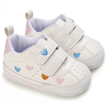 Load image into Gallery viewer, Experience the ultimate in comfort and style with our white embroidered hearts baby sneakers! Adorned with colorful hearts, these sneakers are perfect for babies aged newborn to 18 months. Stay comfortable and steady on your feet with their breathable and non-slip design.
