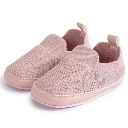 Easily breathable and featherlight infant shoes in shades of pink, white, and grey; perfect for newborns up to 18 months of age.