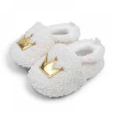 Load image into Gallery viewer, These cozy, snuggly slippers are fit for a royal baby! Made with fluffy teddy bear fabric to keep little toes warm and toasty. Available in sizes for newborns up to 18 months old. Choose from white, grey, or brown.
