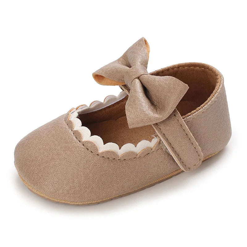 Indulge your little one's feet with our adorable Mary Jane baby shoes in a selection of sweet colors. Perfect for newborns through 18 months old, choose from white, black, apricot, and brown to match any outfit.