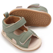 Load image into Gallery viewer, Indulge your little one in the ultimate comfort with our Valentina Baby Sandals, available in a variety of vibrant colors including green, black, white, and brown. Perfect for newborns up to 18 months, these stylish sandals are sure to make a statement and keep your baby&#39;s feet looking and feeling great..
