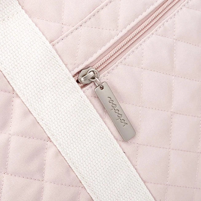 Cool stylish pink diaper bag for mom. This diaper bag is perfect for the fashionable mom. It's made of durable materials and features a sleek pink design.