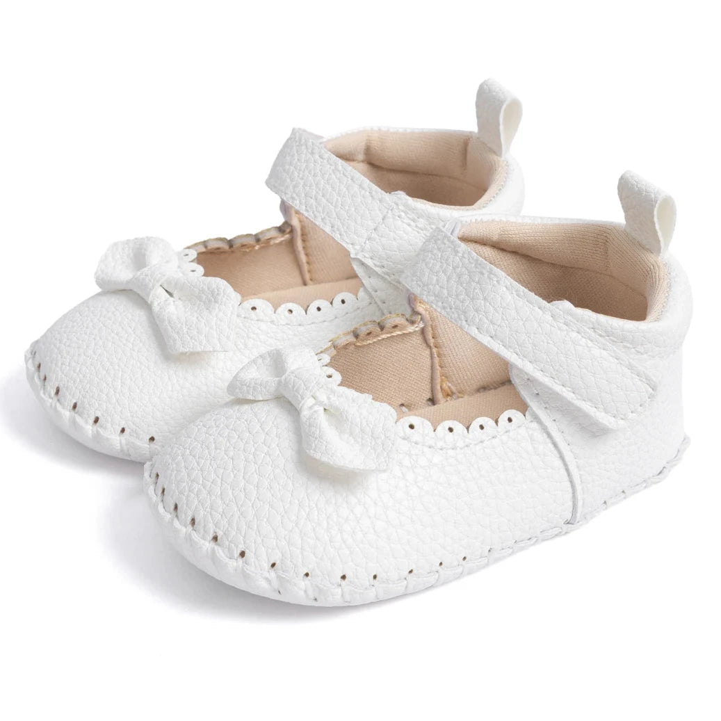 Designed with both style and comfort in mind, these Little Bow-Tie baby shoes are available in a variety of colors and sizes for newborns up to 18 months old. Each pair is meticulously crafted to provide a snug and secure fit for your little princess. Whether you're dressing them up for a special occasion or keeping them comfy for everyday wear, these shoes are the perfect choice for your little one.