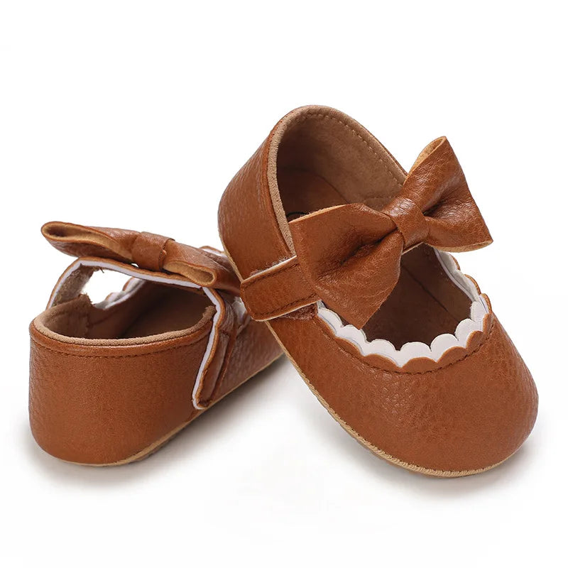 Indulge your little one's feet with our adorable Mary Jane baby shoes in a selection of sweet colors. Perfect for newborns through 18 months old, choose from white, black, apricot, and brown to match any outfit.