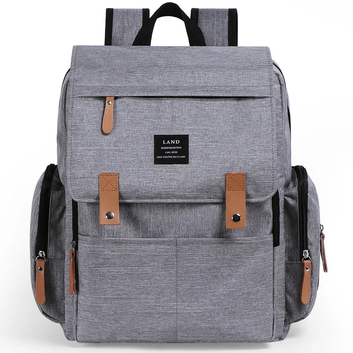 This multifunctional diaper backpack in cool grey is equipped with a thermal pocket, making it the perfect addition to any parent's arsenal. 
