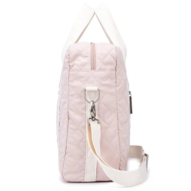 Cool stylish pink diaper bag for mom. This diaper bag is perfect for the fashionable mom. It's made of durable materials and features a sleek pink design.