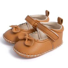 Load image into Gallery viewer, Designed with both style and comfort in mind, these Little Bow-Tie baby shoes are available in a variety of colors and sizes for newborns up to 18 months old. Each pair is meticulously crafted to provide a snug and secure fit for your little princess. Whether you&#39;re dressing them up for a special occasion or keeping them comfy for everyday wear, these shoes are the perfect choice for your little one.
