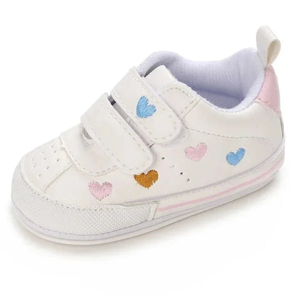 Experience the ultimate in comfort and style with our white embroidered hearts baby sneakers! Adorned with colorful hearts, these sneakers are perfect for babies aged newborn to 18 months. Stay comfortable and steady on your feet with their breathable and non-slip design.