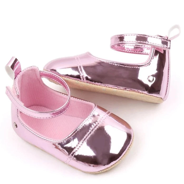 The perfect first time walker shoes for your little walker. Shower your little one's feet with style and comfort with our Bling Baby Shoes | Multiple Colors! Designed for newborns to 18 months, these shoes are perfect for your child's first steps. Supportive and durable, they'll keep your little walker's feet protected as they explore the world. Give them the confidence to take those first steps with our Bling Baby Shoes