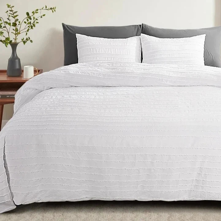 Transform your bedroom with our White Tufted Duvet Cover Set, made from the softest microfiber that replicates light fluffiness. The stunning tufted design adds a touch of beauty and elegance, perfect for layering with other cozy and tactile accessories. Available in full, queen, king, and California King sizes, this set offers amazing huggable softness for you to indulge in. Ignite your senses and elevate your sleep experience with this must-have product!