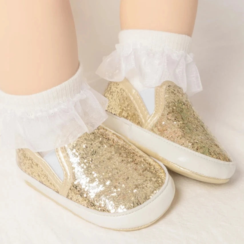 Not only will your little angel look fashionable in these stylish gold, silver and white baby loafers, but they will also stay safe and comfortable with their anti-slip, soft-sole design. Perfect for newborns up to 18 months, these shoes are easy to put on and take off, making your life as a busy parent a little easier. Provide your child with both fashion and function with our sparkling loafers in multiple colors and sizes.