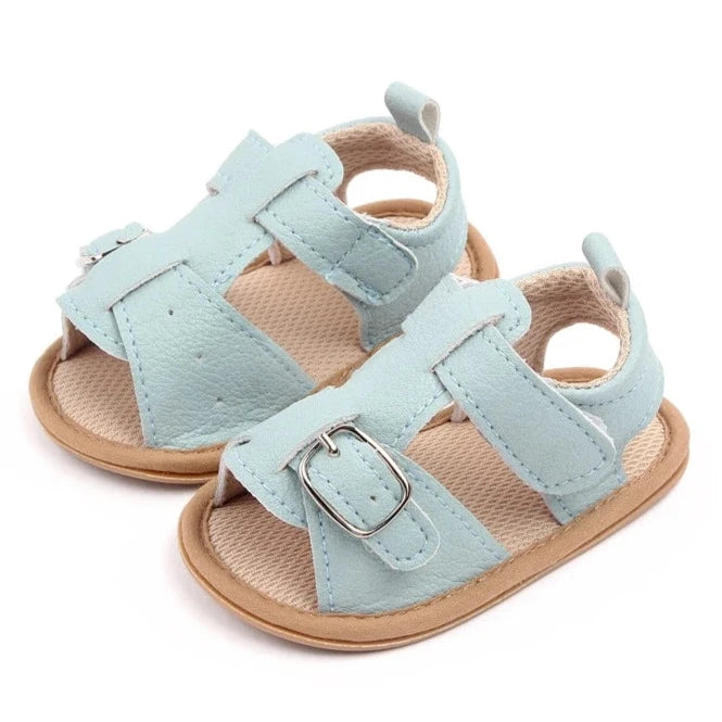 Bring comfort and style to your little one's summer with these adorable sandals in vibrant yellow, crisp white, and cool blue. Perfect for newborns to 18-month-olds, these sandals will have your baby looking cute from every angle. Elevate your baby's style with these adorable and versatile sandals! Keep your little one's feet cool and comfortable all summer long with these must-have sandals