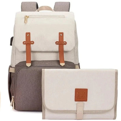 Beige and taupe collide in this chic and stylish baby diaper backpack. Complete with thermal compartments, this diaper bag is the epitome of class and luxury.